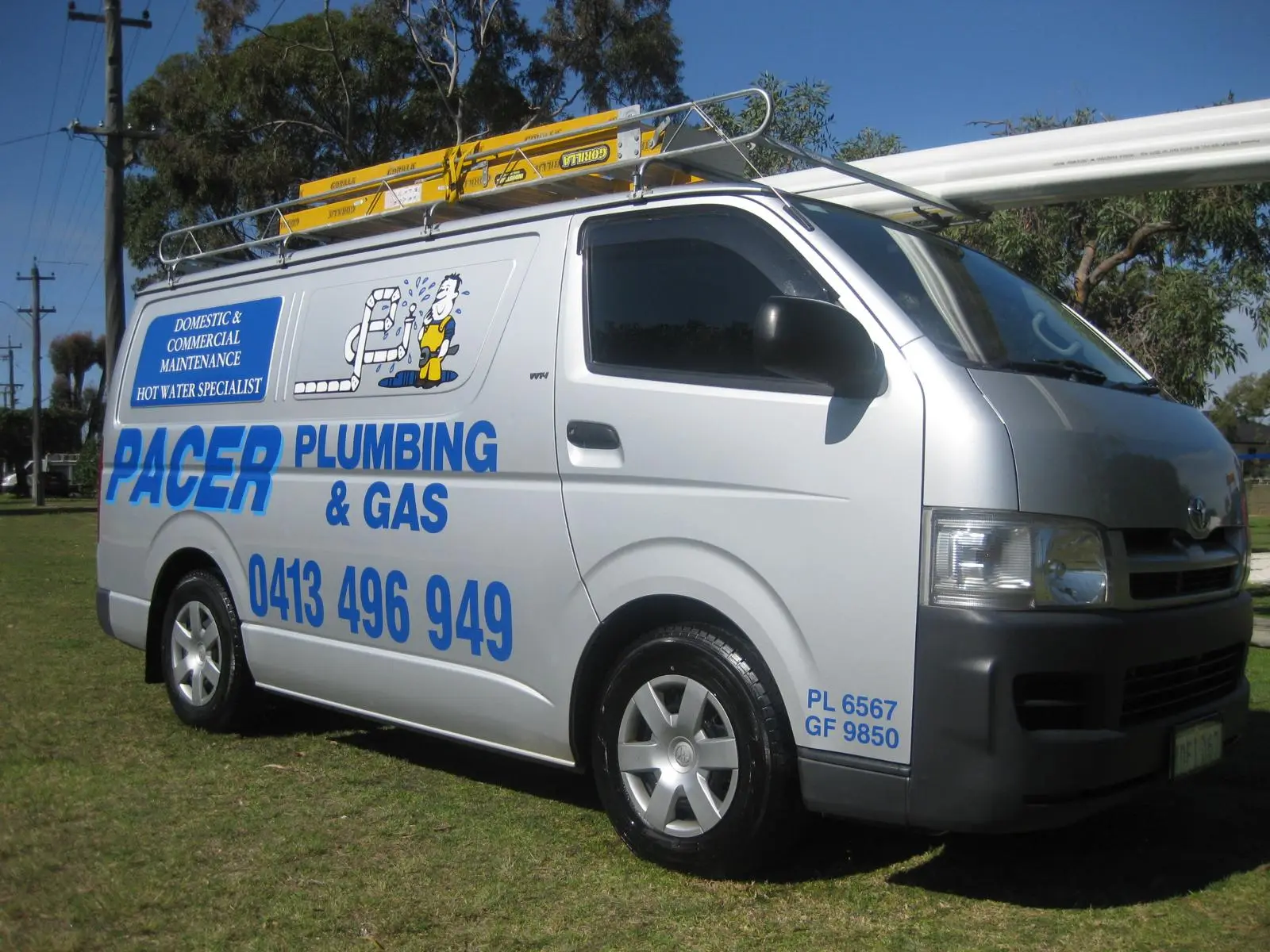 Pacer Plumbing & Gas service van parked on grass in Perth